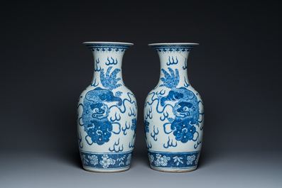 A pair of Chinese blue and white 'Buddhist lion' vases, 19th C.