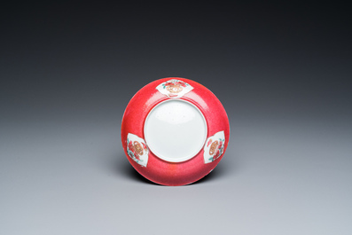 A Chinese famille rose ruby-ground cup and saucer, Yongzheng