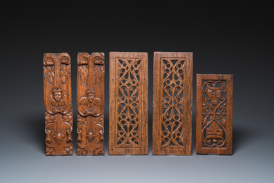 A collection of 11 carved wooden panels with various designs, France, Holland and/or Flanders, 14/16th C.