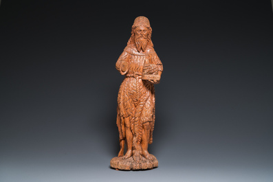 A large carved oak sculpture of John the Baptist holding the Lamb, 16th C.