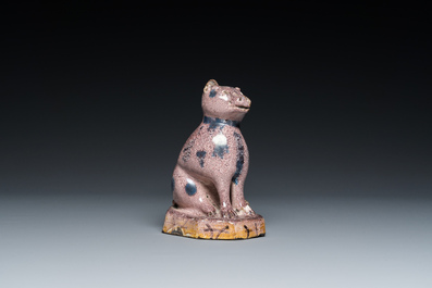A manganese faience model of a cat, probably northern France, dated 1709