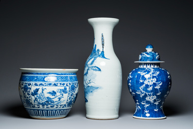 A Chinese blue and white 'landscape' vase, a covered vase and a jardini&egrave;re, 19th C.