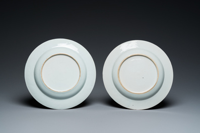 A pair of Chinese famille rose 'magpie and prunus' plates with bianco-sopra-bianco rims, Yongzheng
