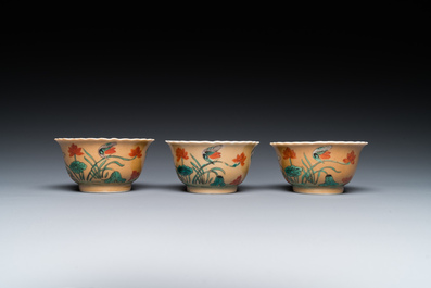 Three Chinese Kangxi-style caf&eacute;-au-lait-ground famille verte cups and saucers, rabbit mark, 19th C.