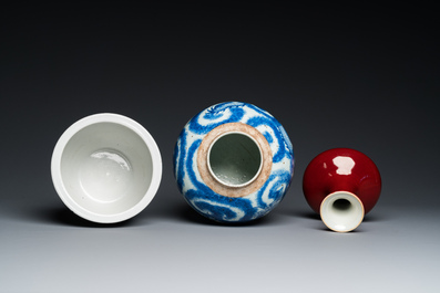 Three Chinese blue and white vases and a monochrome red vase, 19th C.