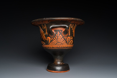 A Greek Apulian red figure bell krater with a winged female and a lady's head, 4th C. b.C.