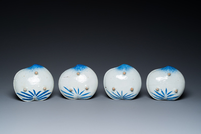 Four Japanese blue and white peach-shaped 'crane' dishes standing on three feet, Edo, 18/19th C.
