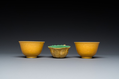 A Chinese sancai-glazed water dropper and a pair of yellow-glazed anhua 'dragon' bowls, Xianfeng mark, Kangxi and later