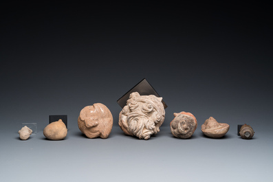 Eight various carved stone heads, incl. Chinese, Etruscan, Gandhara and Japanese