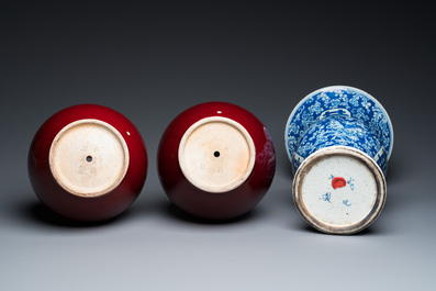 A Chinese blue and white 'Shou' vase with butterflies and a pair of sang-de-boeuf-glazed bottle vases, 19/20th C.