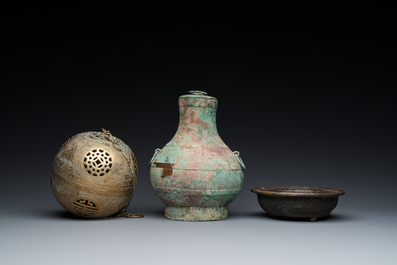 A varied collection of Chinese and Tibetan bronze, brass and wood objects, 19/20th C.