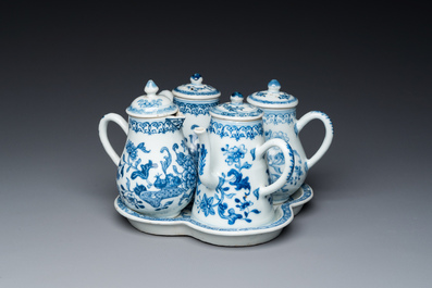 A rare Chinese blue and white set of two jugs and two casters on stand, Qianlong