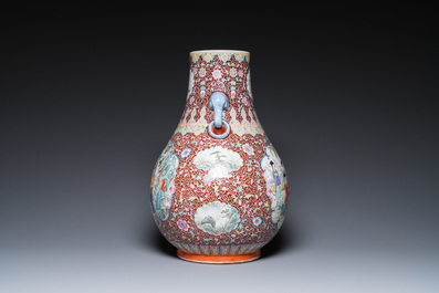 A Chinese famille rose 'hu' vase and a pair of fish bowls, 20th C.