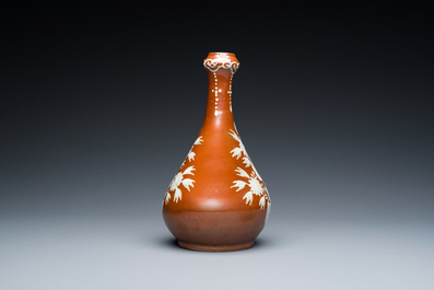 A Chinese slip-decorated brown-ground bottle vase, Zhushan kilns, late Ming