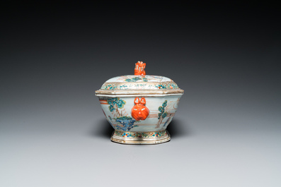 A Chinese octagonal famille rose 'mandarin subject' tureen and cover on stand, Qianlong