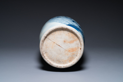 A large Chinese blue, white and copper-red vase with a mountainous river landscape, 19th C.