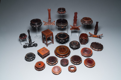 A collection of 25 fine Chinese wooden stands, 19/20th C.