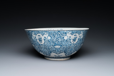 A very fine and rare Dutch Delft blue and white bowl with grotesques in the style of Daniel Marot, dated 1720
