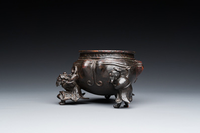 A Chinese lacquered bronze 'foreigners' censer, Ming