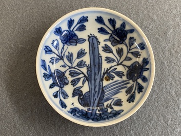 A Chinese blue and white saucer with a pheasant behind a rock, 'rabbit' mark, Wanli