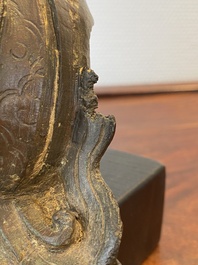 Een Chinese bronzen Zhen Wu met sporen van lakwerk, Ming