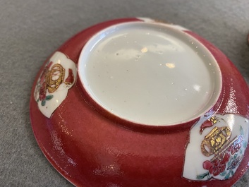 A Chinese famille rose ruby-ground cup and saucer, Yongzheng