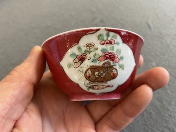 A Chinese famille rose ruby-ground cup and saucer, Yongzheng