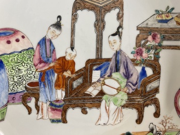 A fine Chinese famille rose eggshell porcelain plate with a boy and two governesses in an interior, Yongzheng