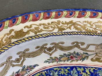 A large Chinese Canton enamel basin with garlands decorated with male heads, Qianlong