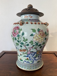 A Chinese famille rose vase with wooden cover, 19th C.