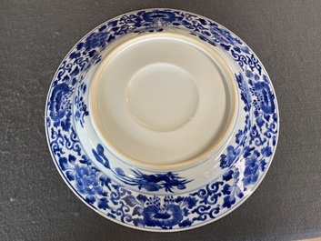 A large Chinese blue and white dish with raised central medallion, Kangxi