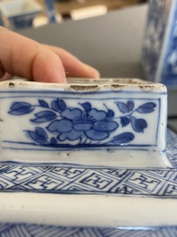 A pair of Chinese blue and white square 'narrative subject' vases and covers, Kangxi