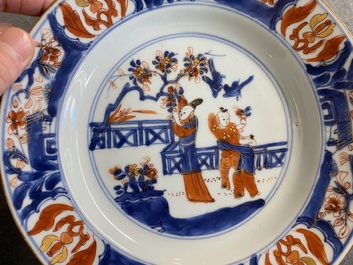 A pair of Chinese Imari-style 'lady with two boys' plates, Kangxi