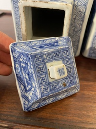 A pair of Chinese blue and white square 'narrative subject' vases and covers, Kangxi