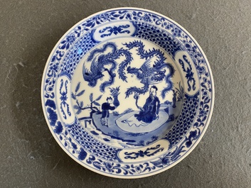 A Chinese blue and white 'two phoenixes and an immortal' plate, Kangxi/Yongzheng