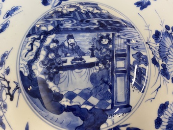 A large Chinese blue and white dish with raised central medallion, Kangxi