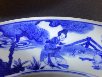 A large Chinese blue and white dish with raised central medallion, Kangxi