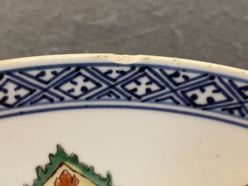 A Chinese blue and white 'peony scroll' dish and a famille verte dish, Kangxi