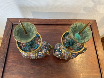 A pair of Chinese cloisonn&eacute; candlesticks in the shape of pixiu, Qing