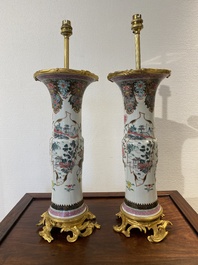 A pair of Chinese famille rose vases with fine gilt bronze lamp mounts, Yongzheng