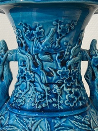 A pair of Chinese turquoise-glazed 'lotus' vases, 19th C.