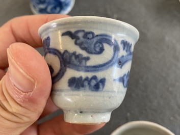 Eight Chinese mostly blue and white wine and tea cups, Ming