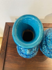 A pair of Chinese turquoise-glazed 'lotus' vases, 19th C.