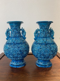 A pair of Chinese turquoise-glazed 'lotus' vases, 19th C.