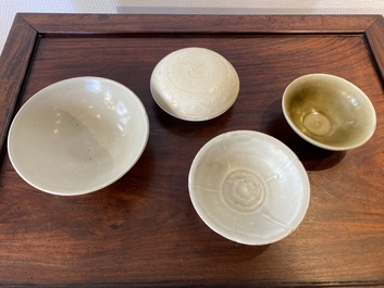 Three Chinese celadon- and qingbai-glazed bowls and a cream-glazed box and cover, Song and later