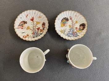 A pair of Chinese famille rose relief-decorated cups and saucers, Yongzheng