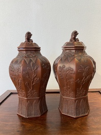 An extremely rare pair of Chinese Yixing stoneware octagonal vases and covers, Kangxi