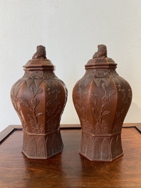 An extremely rare pair of Chinese Yixing stoneware octagonal vases and covers, Kangxi