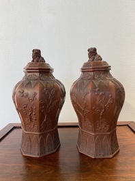 An extremely rare pair of Chinese Yixing stoneware octagonal vases and covers, Kangxi