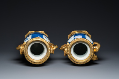A pair of Chinese blue, white and copper-red powder blue-ground rouleau vases with fine gilt bronze mounts, Kangxi and 19th C.